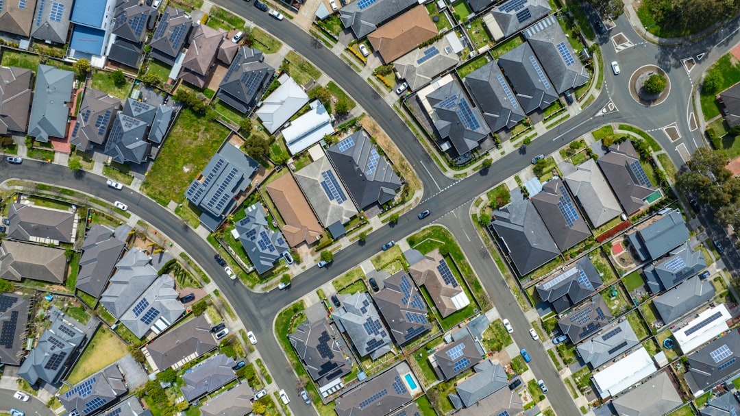 Aerial view of a suburban neighborhood with houses and streets.